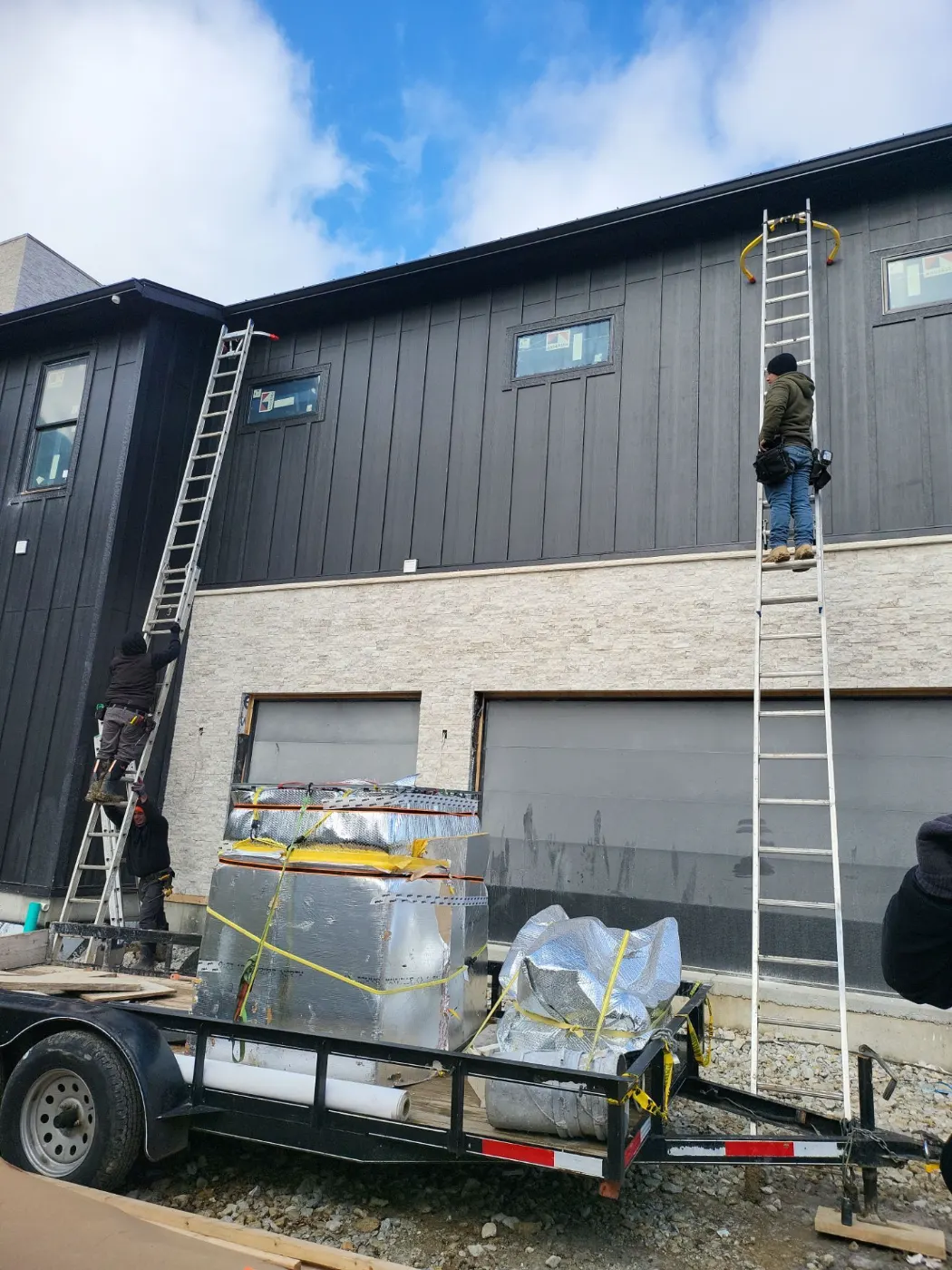 Siding installation documented in Sandstone Lakes