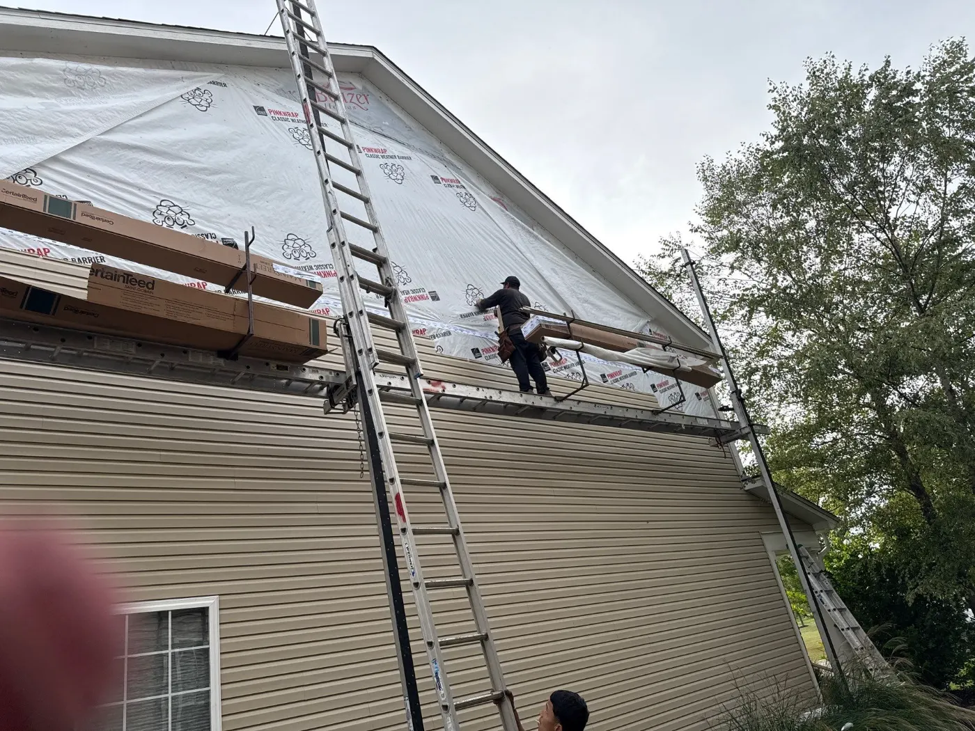 Storm-damaged siding documented in Sandstone Lakes